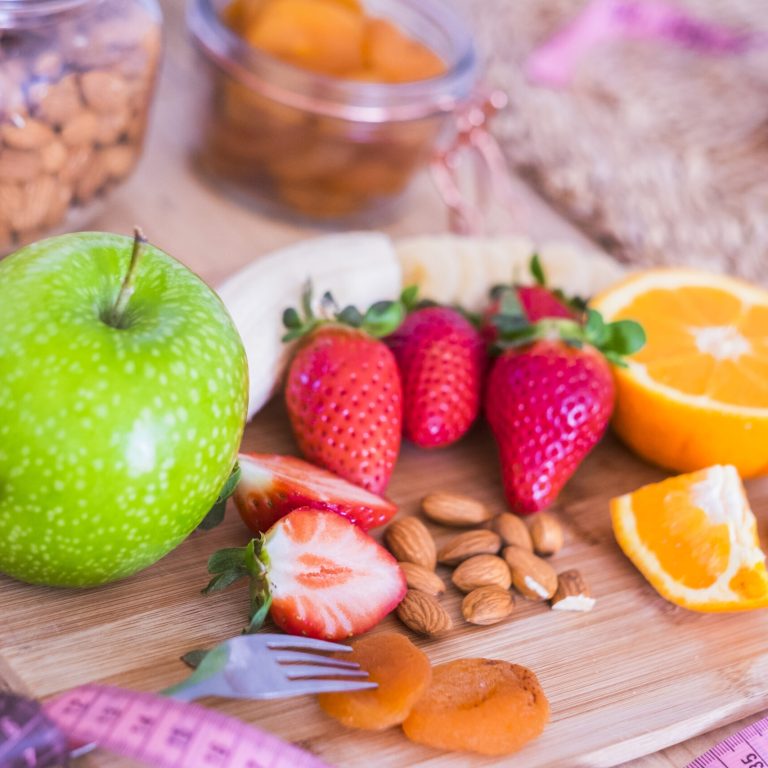 beautiful table full of food like fruits to have a good and nice breakfast at home to lose weight and stay better with yourself - in the table there are banana, framberry, orange, apple and more